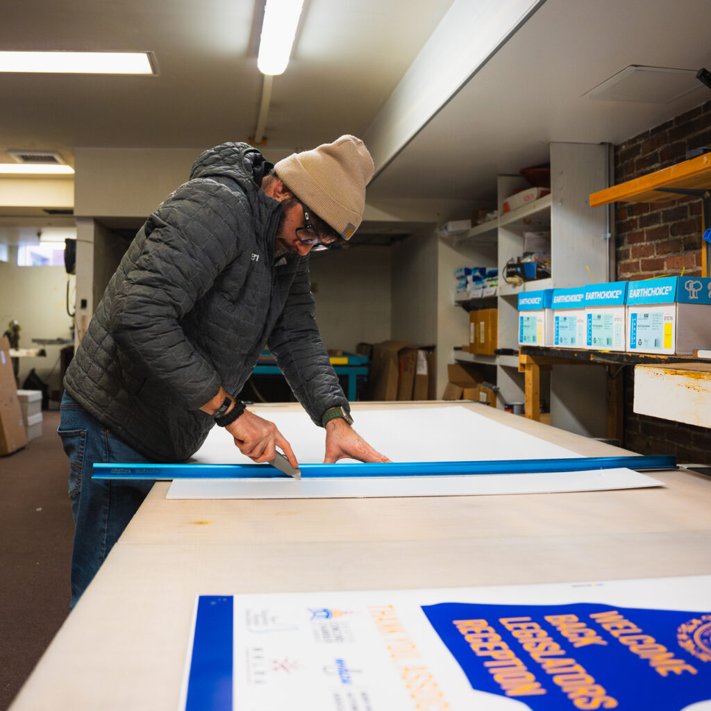 Trimming a large-format print at Capitol Copy