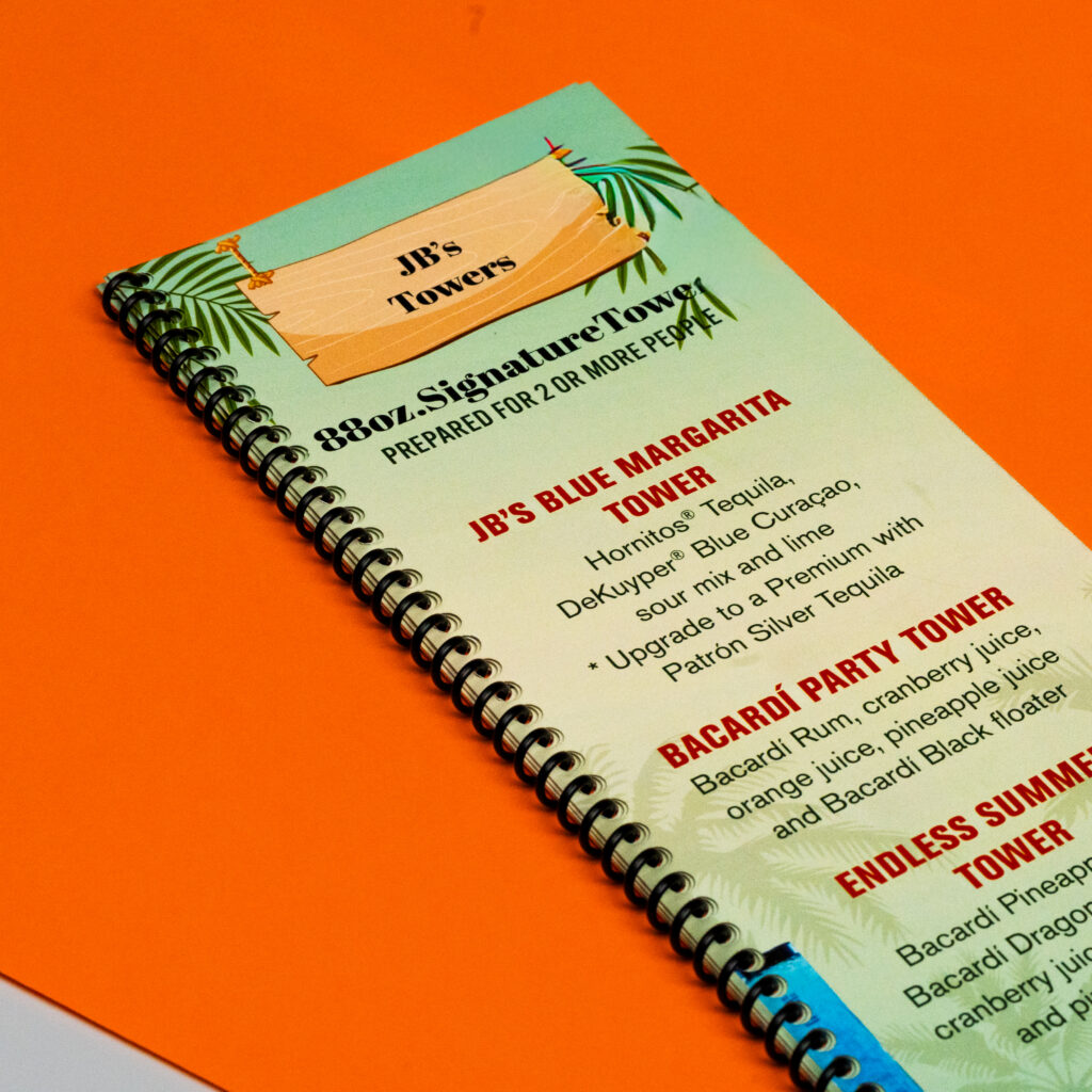 Spiral-bound drink menu printed by Capitol Copy